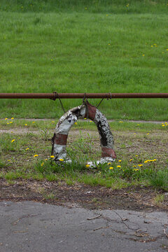 Old Weathered Life Ring With Severely Peeling Paint On Rusty Pole